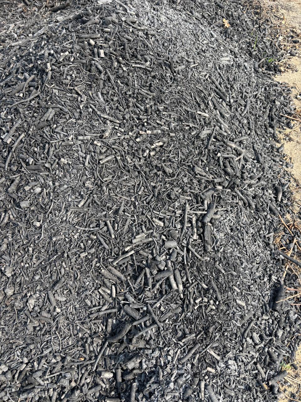 A field of biochar material prepared for handling